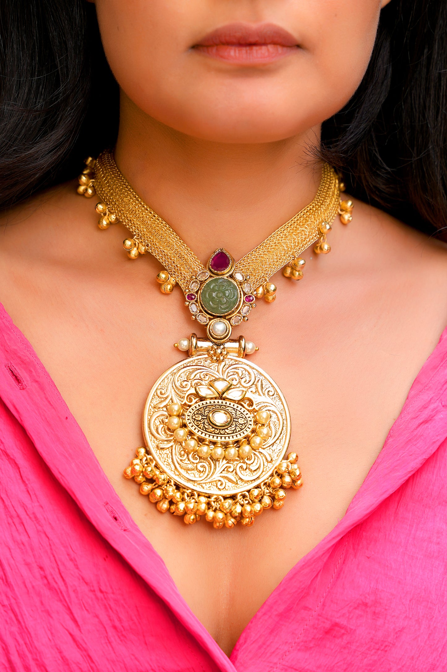 Heritage Gold-Plated Hasli Choker with Carved Emerald Green Stone and Ornate Temple Pendant