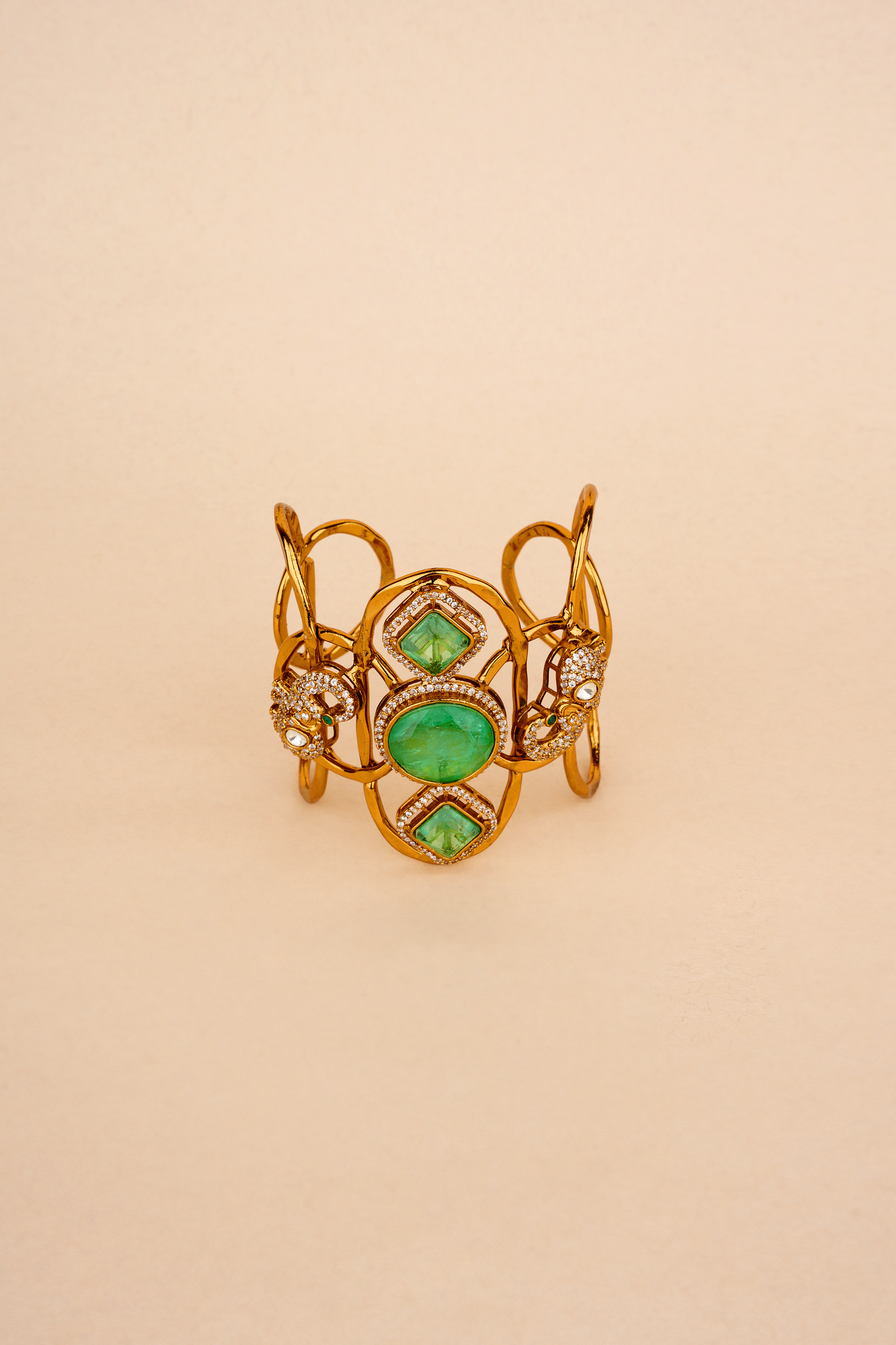 Gold Plated Cuff with Green stones & Peacock motif with American Diamonds